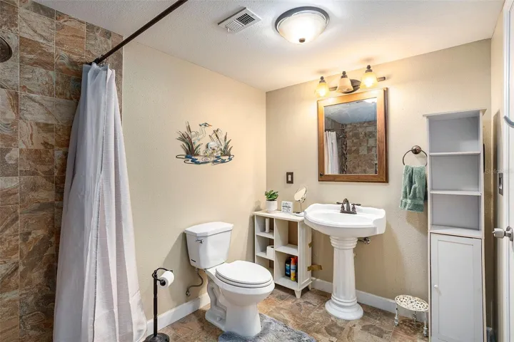 Pedestal sink is perfect for this spacious bath!