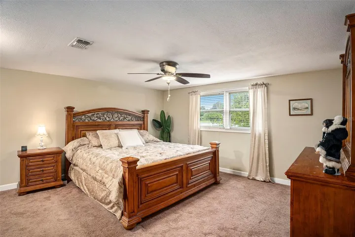 Primary bedroom is super spacious and has nooks for dressers!