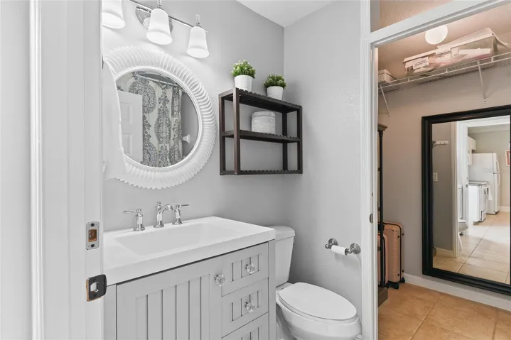 Bathroom was updated with new vanity, lighting and mirror