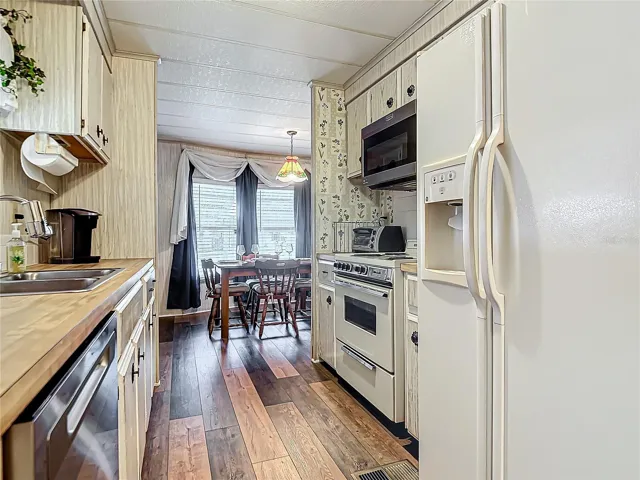 The kitchen has the updated vinyl plank flooring as well