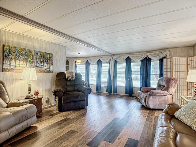 Spacious living area with beautifully updated vinyl plank flooring