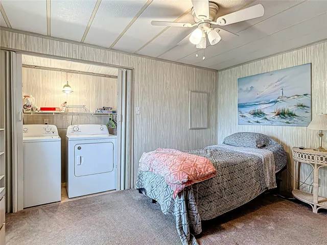 The guest bedroom has a laundry closet and walk in closet