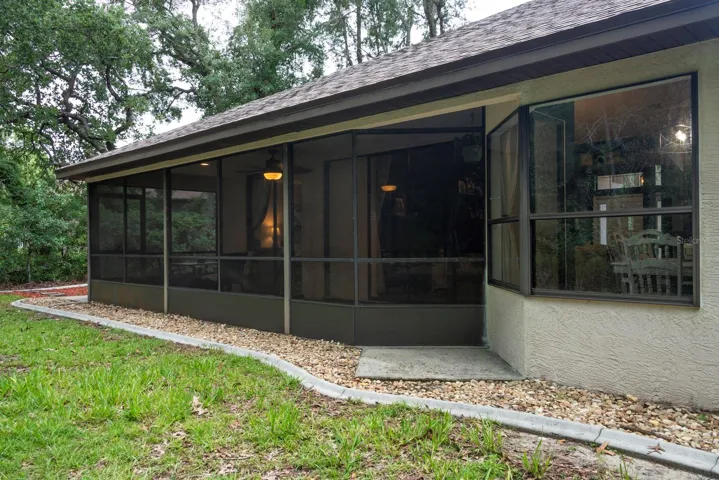 Lovely screened porch to enjoy the green belt preserve behind the home