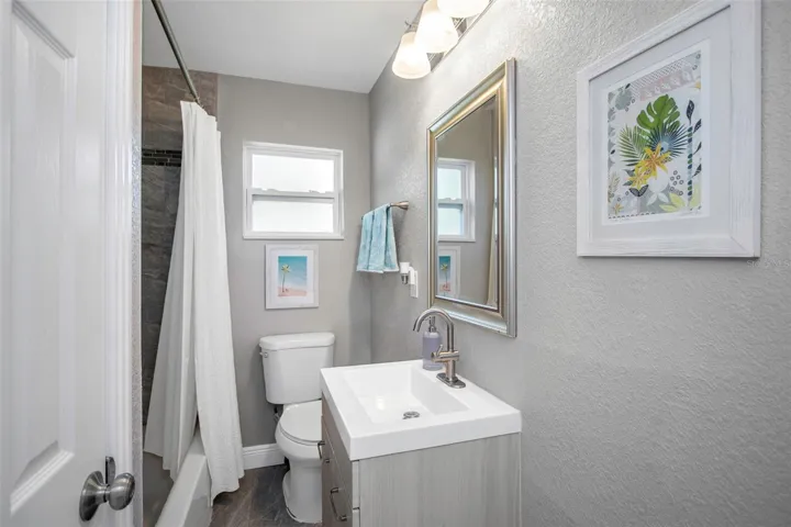 Updated bath with tub and shower