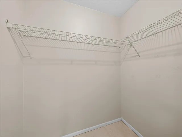 Walk in closet in primary bedroom
