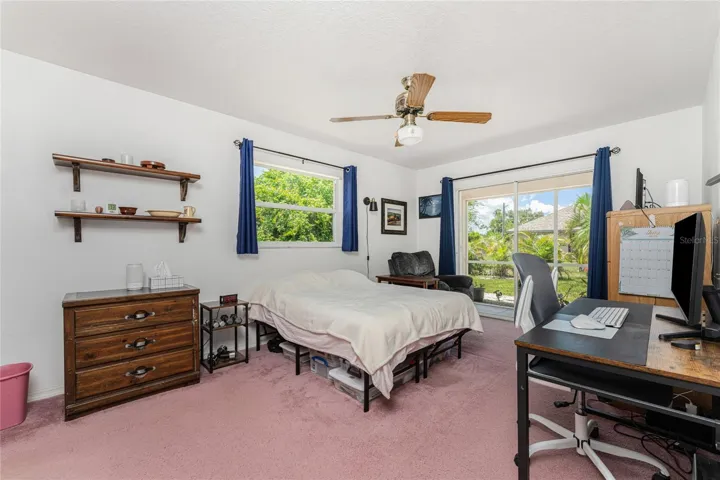 Master bedroom has another set of sliding glass doors leading to the lanai.