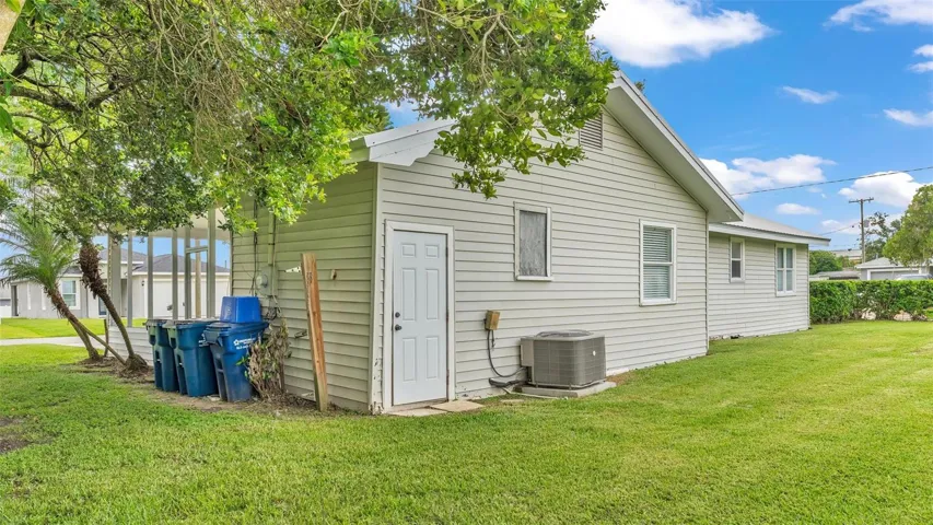 Laundry area & more storage area off carport