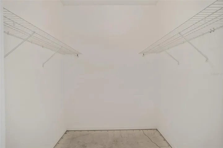 Primary bedroom walk in closet #1