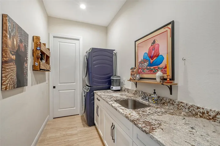 Laundry room with storage closet