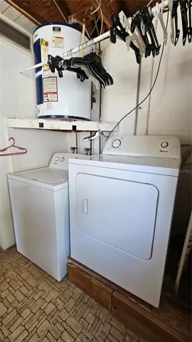 Washer, Dryer and Water Heater. Note, elevated dryer