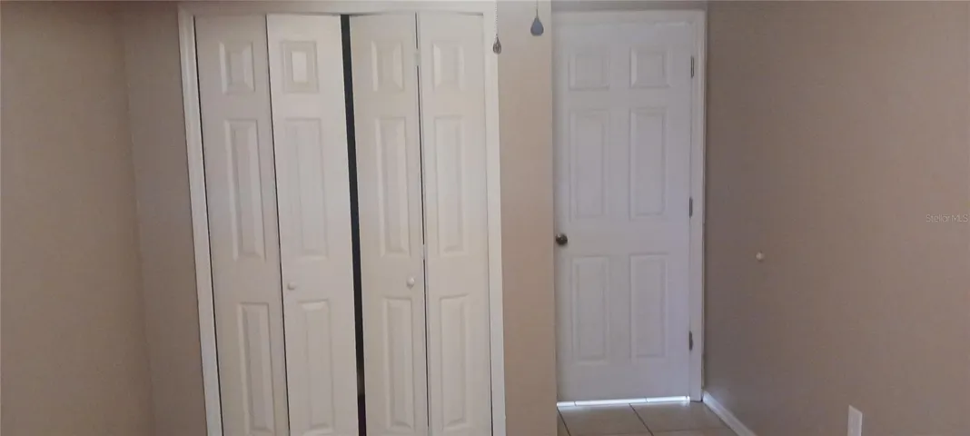 second bedroom door and closet