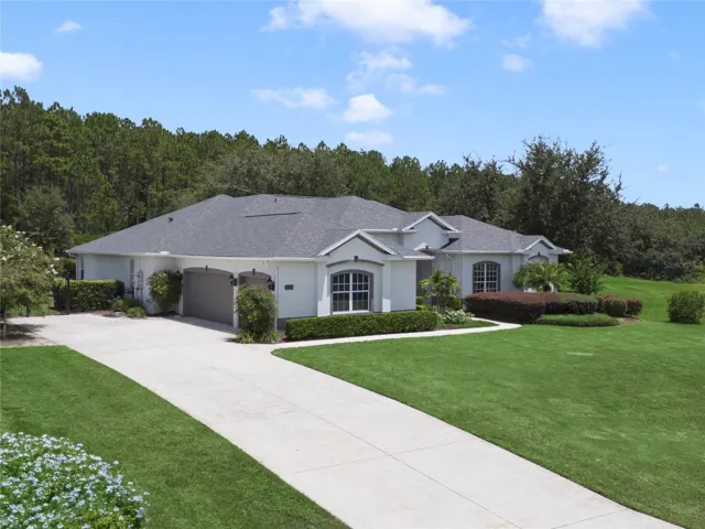 Side showing garage, driveway and parking