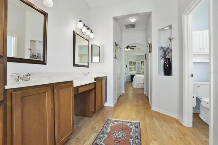 Primary  Bathroom also has a water closet and dual walk in closets between bedroom and bathroom