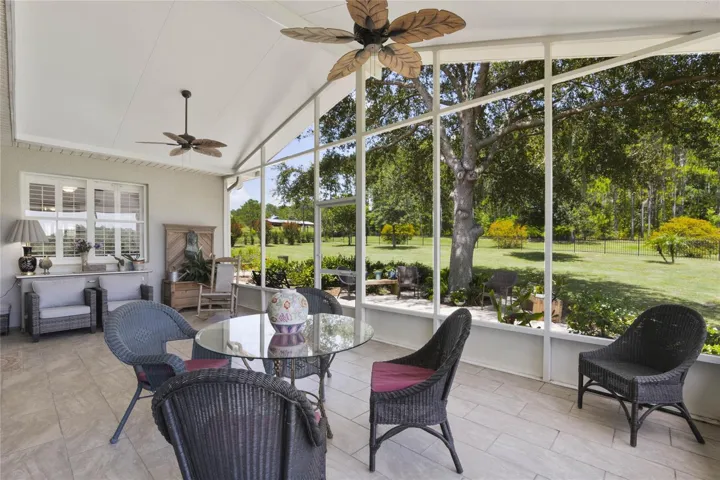 Lanai with vaulted ceilings and screened in