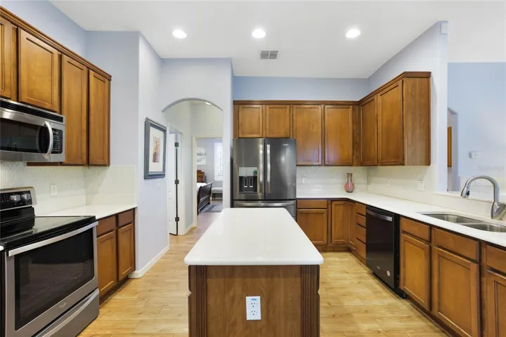 Kitchen has Island and breakfast bar area