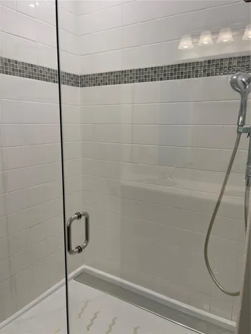 Frameless shower enclosure.