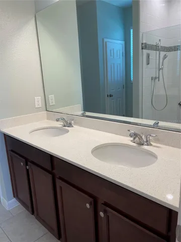 Dual vanities in main bathroom.