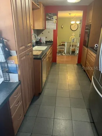 Opposite end of the expanded galley kitchen opens up to dining area