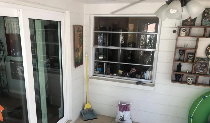 Large window looking out from Kitchen desk area to screened lanai