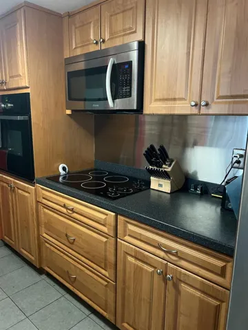 updated kitchen with passthrough window to bonus room just off the screened porch!