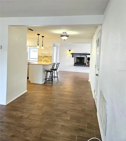 Living room looking toward family room and kitchen