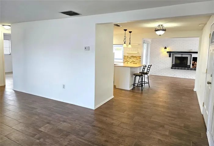 Living room looking toward family room and kitchen