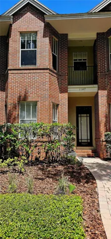 Front exterior of building with brick exterior and stunning curb appeal.