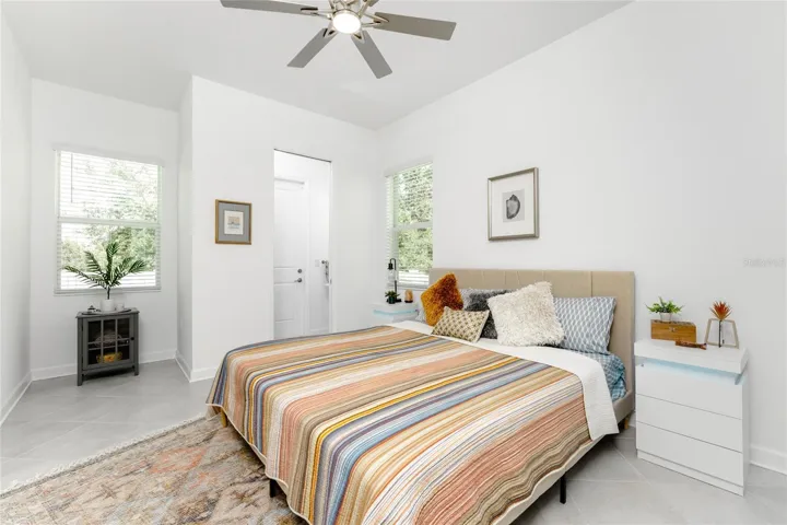 Guest bedroom with private 12 Bath with access to the backyard or a perfect pool bath.