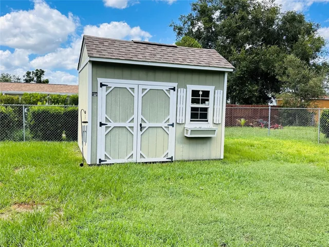 STORAGE SHED IN LARGE FENCED BACKYARD