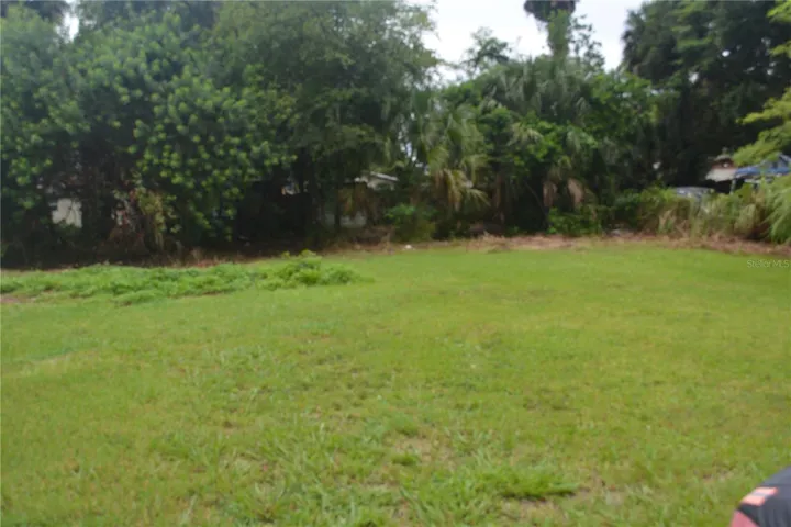 Level lot 50 x 140  BRAND NEW SURVEY you could build a building on the back part of the property or a nice garage