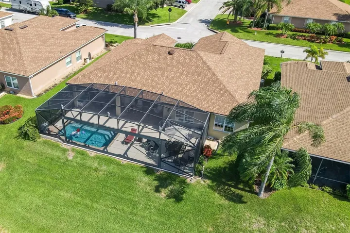 The rear of this home is dominated by the oversized pool area!