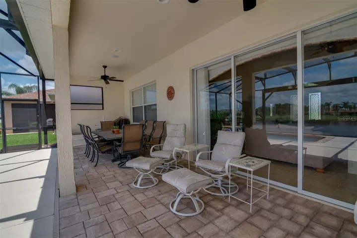 The covered lanai area is accessible from the living room and the dinette.