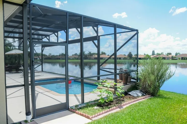 The view from the pool out to the lake is enhanced by the special polyester screening that spans 30' without any obstructions.