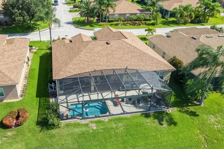 The huge birdcage spans the entire pool area.