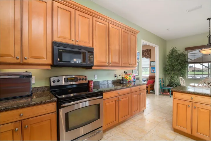 The large kitchen with its quality cabinetry makes this a most desirable home.