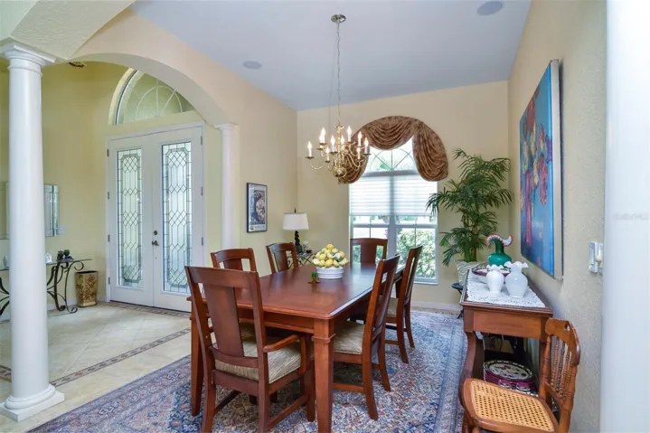 The arched window over the double window provides great natural light for the dining room.