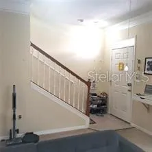 Standing in Livingroom, looking toward Stairs and Front Door