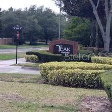 Teak Neighborhood Grill at Entrance to the Community