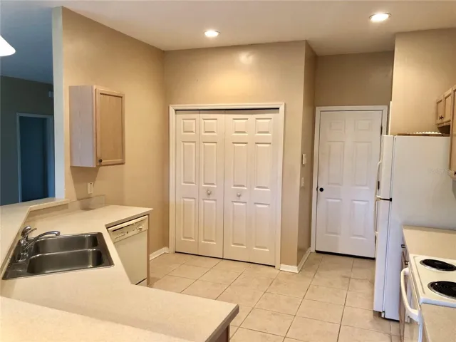 Kitchen with closet laundry