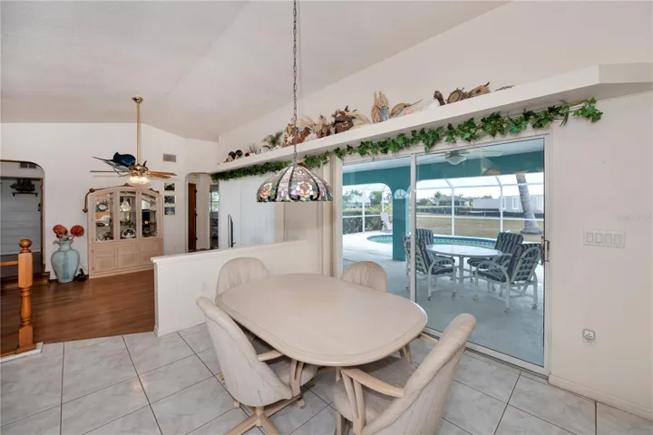 Dining area opens to the expansive lanai and pool.