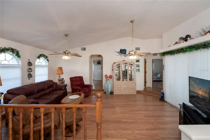 The great room opens to the two auxiliary bedrooms with a Jack n Jill full bathroom AND pool/lanai access, along with sliding doors that open to the lanai & pool deck.