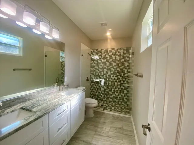 primary bath with double vanity, granite tops