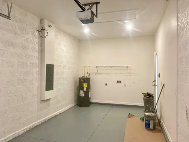 Garage with recessed LED lights, washer/dryer hookup
