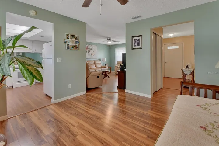 Looking from Den/Office area into living room and kitchen and foyer