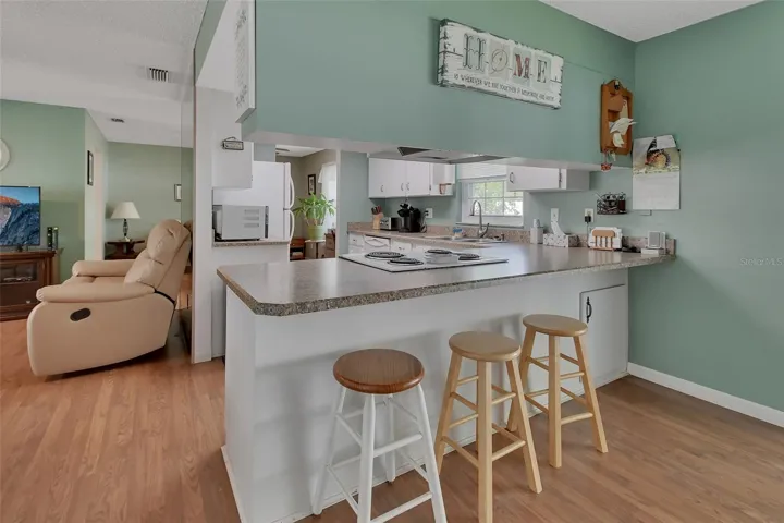 Pass through bar area with seating and under counter storage