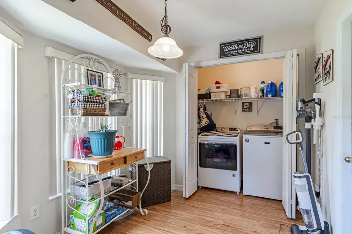Kitchen eat in area and laundry closet