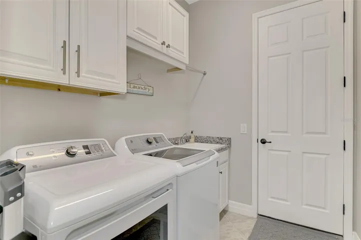 Laundry Room leading to 3 car garage