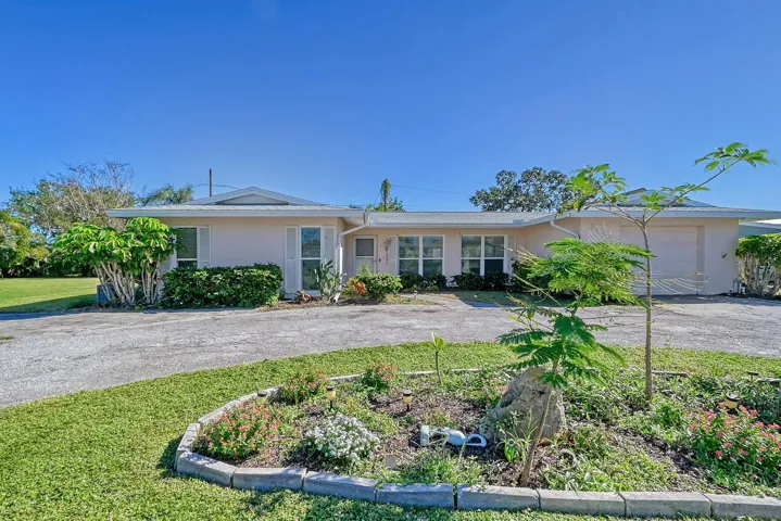 Exterior Front with a Circular Driveway