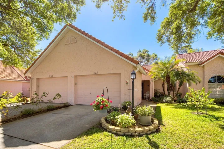 Low maintenance living & an oversize garage with room for your golf cart~