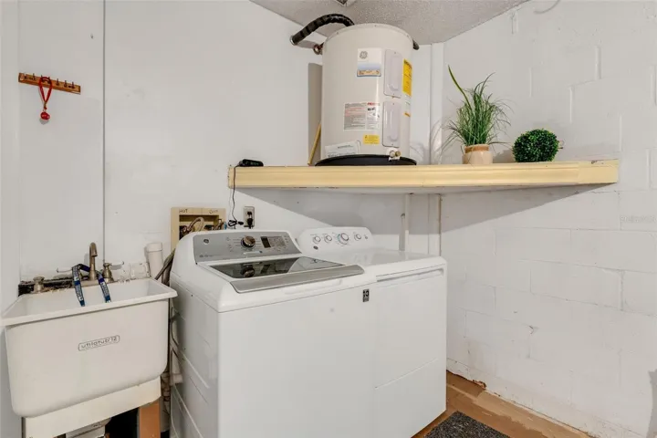 Nice laundry area with convenient utility sink~